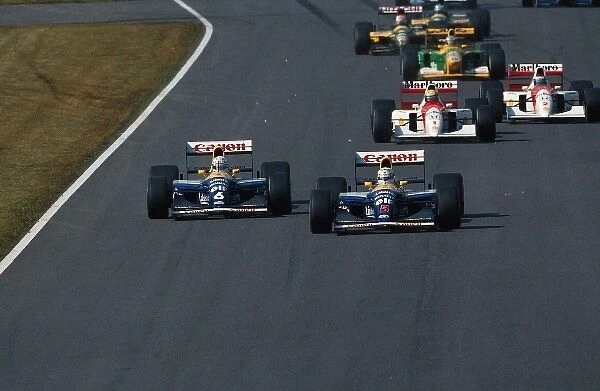 Formula One World Championship: Nigel Mansell Williams FW14B leads at the start of the race