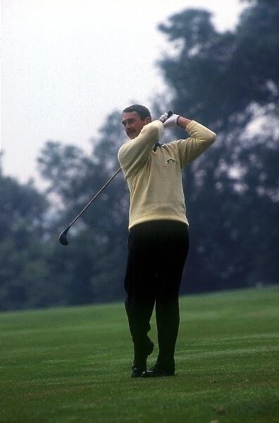 Formula One World Championship: Nigel Mansell plays golf at the Buckingham Golf Club prior to the British Grand Prix