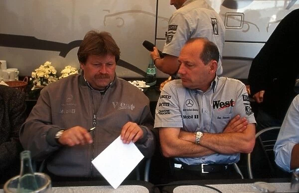 Formula One World Championship: Norbert Haug Mercedes Motorsport Boss and Ron Dennis Mclaren Boss, right