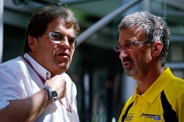 Formula One World Championship: Norbert Haug Mercedes Sporting Director talks with Eddie Jordan Jordan Team Owner