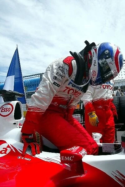 Formula One World Championship: Olivier Panis climbs from his Toyota TF104 on the grid