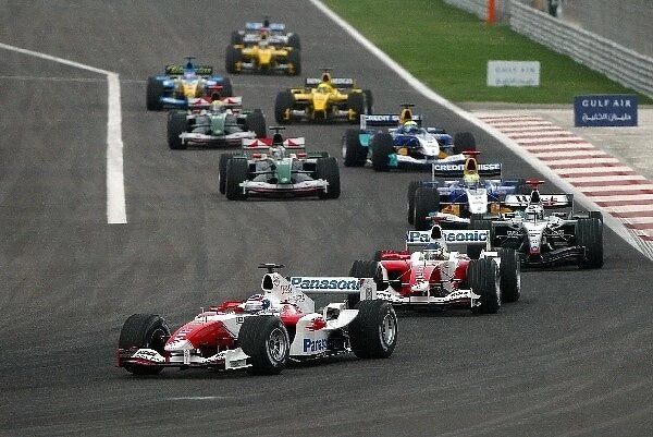 Formula One World Championship: Olivier Panis Toyota TF104 leads the field