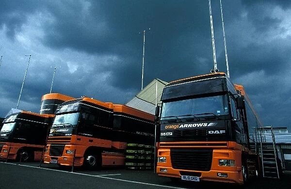 Formula One World Championship: The Orange Arrows team trucks in the paddock