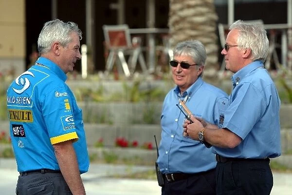 Formula One World Championship: Pat Symonds Renault Executive Director of Engineering chats with Herbie Blash FIA Observer and Charlie Whiting