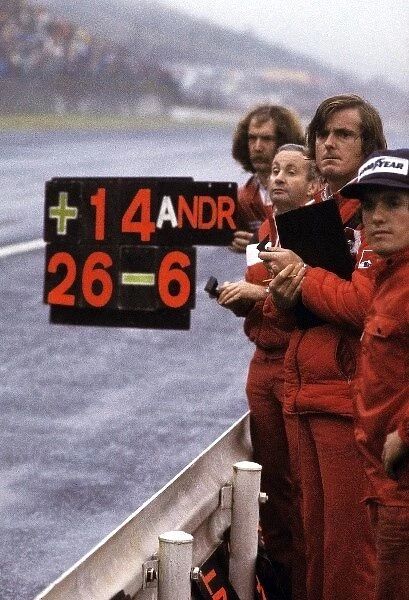 Formula One World Championship: A pit board is held out for third placed World Champion James Hunt McLaren who famously didnÕt trust the information put on it
