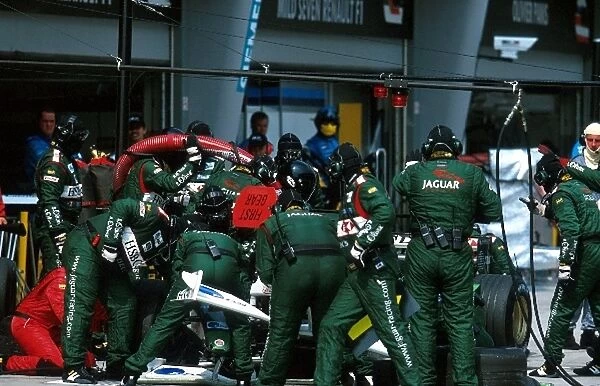 Formula One World Championship: A pit stop to replace the front nose cone on the Jaguar R3 of Eddie Irvine that was retired shortly thereafter