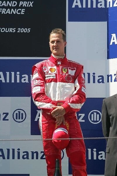 Formula One World Championship: Third place finisher Michael Schumacher Ferrari on the podium