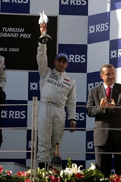Formula One World Championship: Third place Juan Pablo Montoya McLaren celebrates on the podium