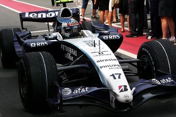 Formula One World Championship: Third placed Alex Wurz Williams FW29 arrives in parc ferme