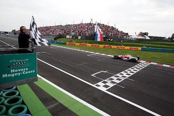 Formula One World Championship: Third placed Jarno Trulli Toyota TF108 takes the chequered flag