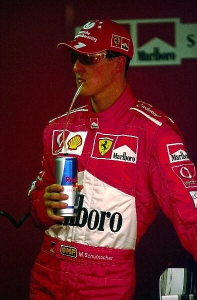 Formula One World Championship: Third placed Michael Schumacher Ferrari enjoys a Red Bull