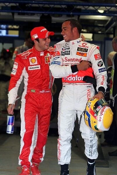 Formula One World Championship: third placed qualifier Felipe Massa Ferrari with second placed Lewis Hamilton McLaren in parc ferme