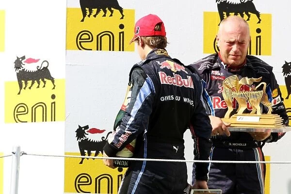 Formula One World Championship: Third placed Sebastian Vettel Red Bull Racing leaves the podium