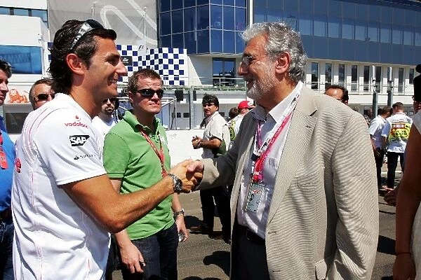 Formula One World Championship: Placido Domingo Opera Singer and Pedro De La Rosa McLaren Test Driver on the grid