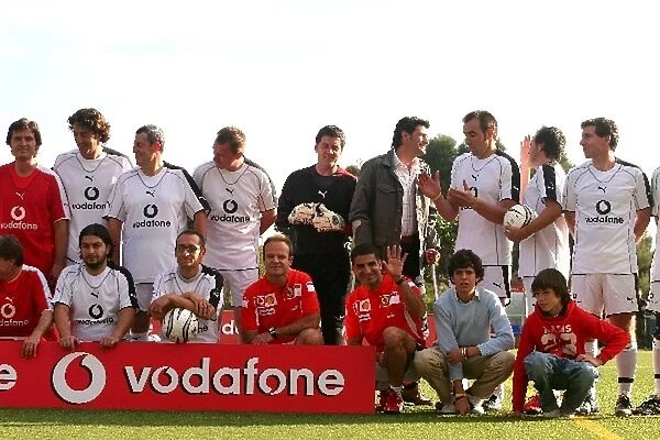 Formula One World Championship: Players in the Copa Vodafone Ferrari football match pose before the game