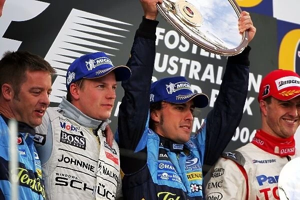Formula One World Championship: The podium: Kimi Raikkonen McLaren, second; Fernando Alonso Renault, winner; Ralf Schumacher Toyota, third