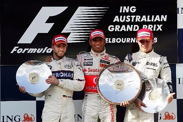Formula One World Championship: The podium: Nick Heidfeld BMW Sauber F1, second; Lewis Hamilton McLaren, race winner; Nico Rosberg Williams, third