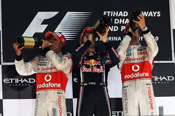 Formula One World Championship: POdium: Lewis Hamilton McLaren, Sebastian Vettel Red Bull Racing and Jenson Button McLaren celebrate