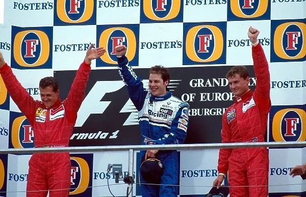 Formula One World Championship: The podium finishers Michael Schumacher Ferrari 2nd, Jacques Villeneuve Williams 1st, David Coulthard McLaren 3rd