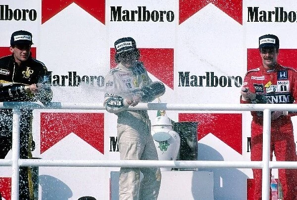 Formula One World Championship: Podium and Results: first Nelson Piquet Williams middle, second Ayrton Senna Lotus left and third Nigel Mansell