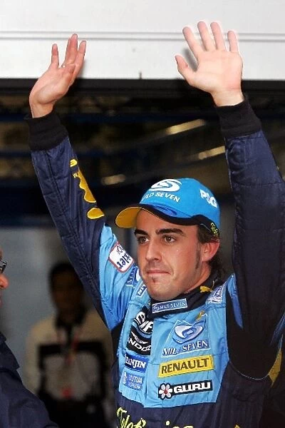 Formula One World Championship: Pole sitter Fernando Alonso Renault celebrates in parc ferme
