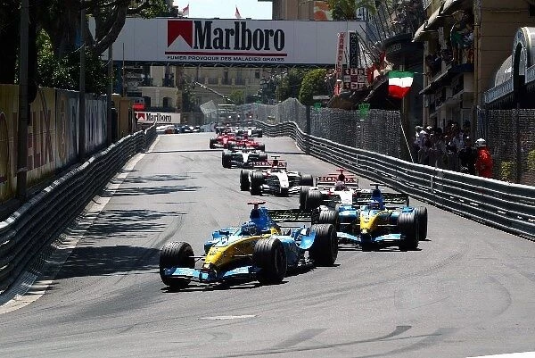 Formula One World Championship: Pole sitter and first time race winner Jarno Trulli Renault R24 leads at the start of the race