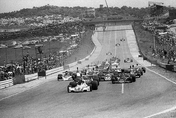 Formula One World Championship: Pole sitter and fourth placed finisher Carlos Reutemann Brabham BT44B leads the field at the start of the race