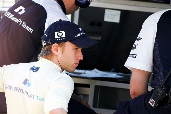 Formula One World Championship: Pole sitter Nick Heidfeld Williams watches qualifying from the pit wall