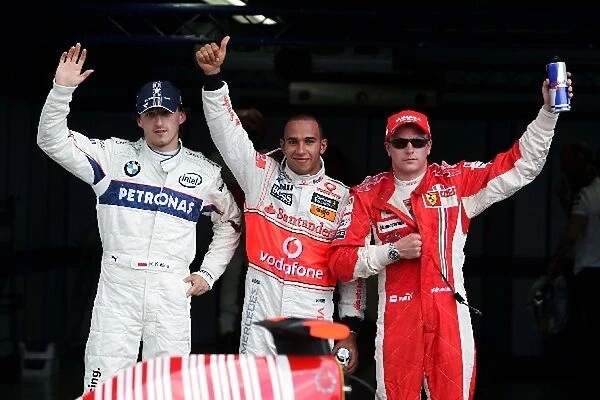 Formula One World Championship: Post qualifying parc ferme Robert Kubica BMW Sauber F1, second; Lewis Hamilton McLaren pole position; Kimi Raikkonen Ferrari