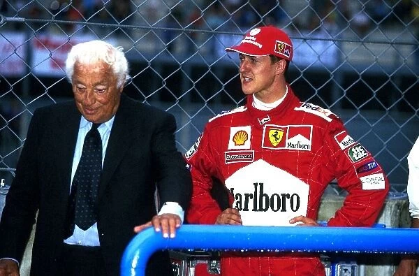 Formula One World Championship: President of FIAT Gianni Agnelli with Michael Schumacher Ferrari