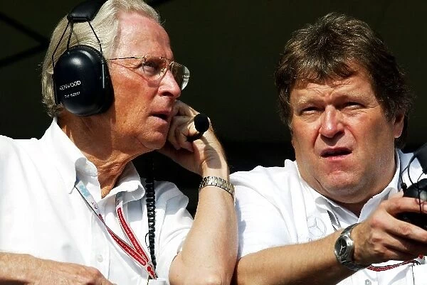 Formula One World Championship: Professor Jurgen Hubbert Daimler Chrysler talks with Norbert Haug Mercedes Sporting Director