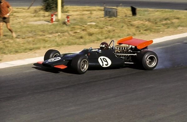 Formula One World Championship: Race retiree Jackie Oliver BRM P153 controls a wild slide