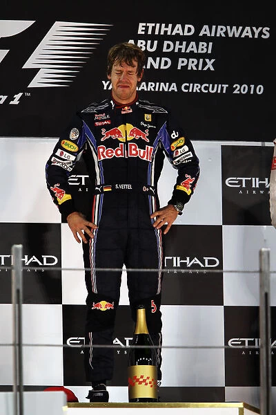Formula One World Championship: Race winner and 2010 World Champion Sebastian Vettel Red Bull Racing on the podium