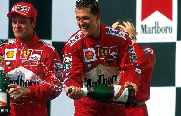 Formula One World Championship: Race winner for the fifty-first time and World Champion for the fourth Michael Schumacher sprays the celebratory