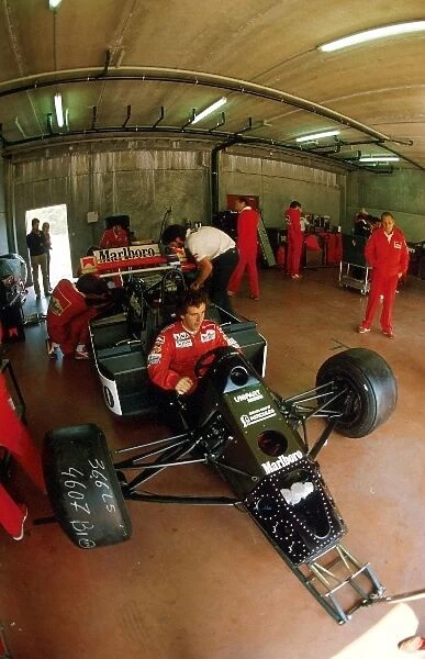 Formula One World Championship: Race winner Alain Prost has his McLaren MP4  /  2 prepared for the first race of the season by his mechanics