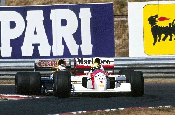 Formula One World Championship: Race winner Ayrton Senna McLaren MP4  /  7A leads Nigel Mansell Williams FW14B, whose second position was enough