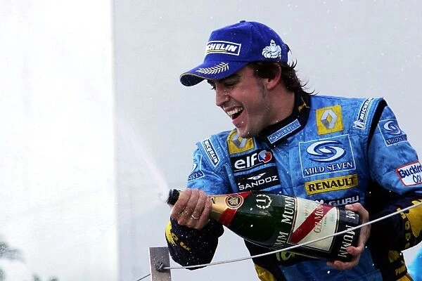 Formula One World Championship: Race winner Fernando Alonso Renault celebrates on the podium