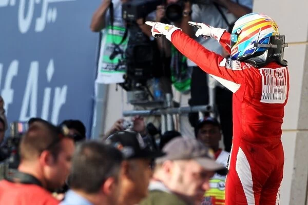 Formula One World Championship: Race winner Fernando Alonso Ferrari celebrates in parc ferme
