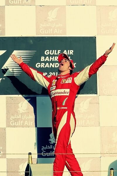 Formula One World Championship: Race winner Fernando Alonso Ferrari celebrates on the podium