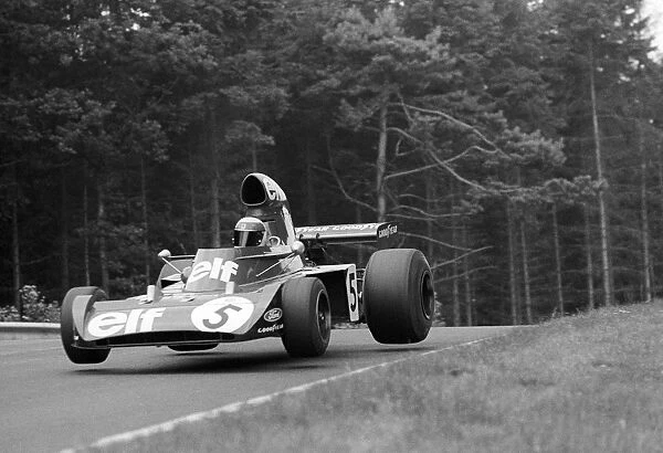 Formula One World Championship: Race winner Jackie Stewart Tyrrell 006 leaves the air on a jump a little way past Pflanzgarten