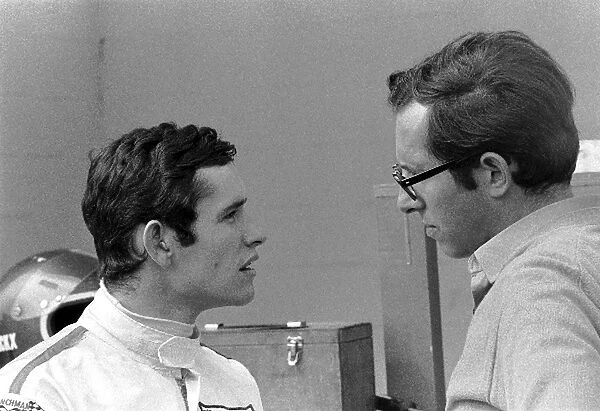 Formula One World Championship: Race winner Jacky Ickx with Ferrari designer Mauro Forghieri
