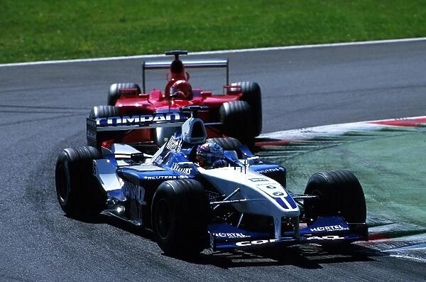 Formula One World Championship: Race winner Juan Pablo Montoya BMW Williams FW23 closely followed by Michael Schumacher Ferrari F1 2001