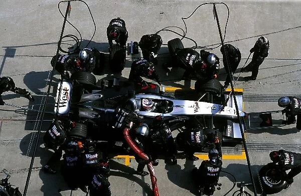 Formula One World Championship: Race winner Kimi Raikkonen, McLaren Mercedes MP4  /  17D, makes his pit stop