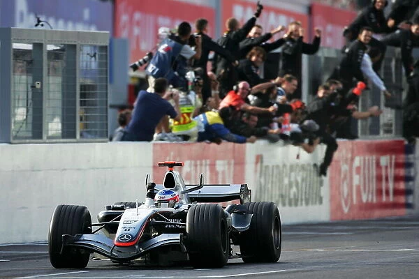 Formula One World Championship: Race winner Kimi Raikkonen McLaren Mercedes MP4  /  20 celebrates at the end of the race
