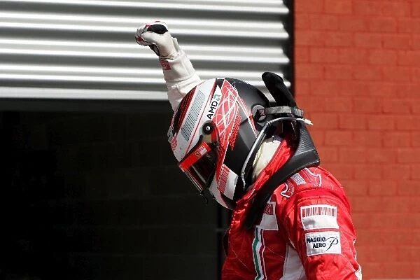Formula One World Championship: Race winner Kimi Raikkonen Ferrari celebrates in parc Ferme