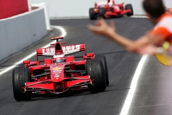 Formula One World Championship: Race winner Kimi Raikkonen Ferrari F2008 enters parc ferme
