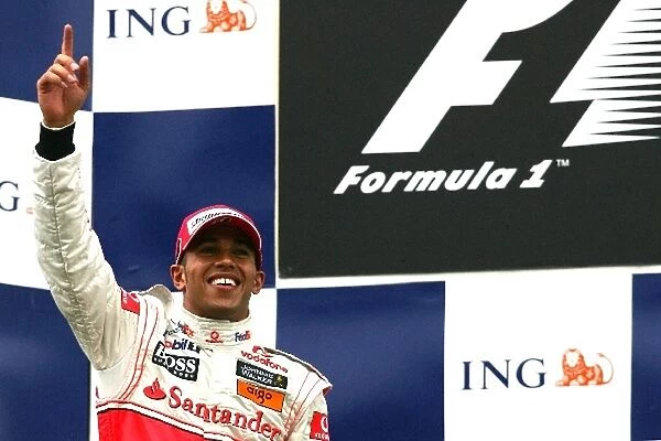 Formula One World Championship: Race winner Lewis Hamilton McLaren on the podium