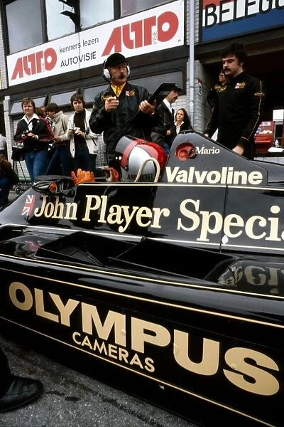 Formula One World Championship: Race winner Mario Andretti Lotus 79 talks with Colin Chapman Lotus Team Owner in the pits