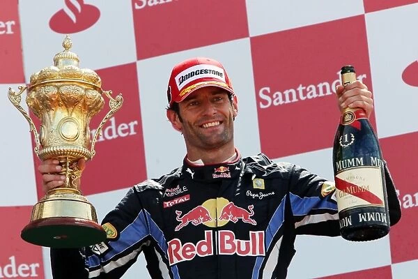 Formula One World Championship: Race winner Mark Webber Red Bull Racing celebrates on the podium
