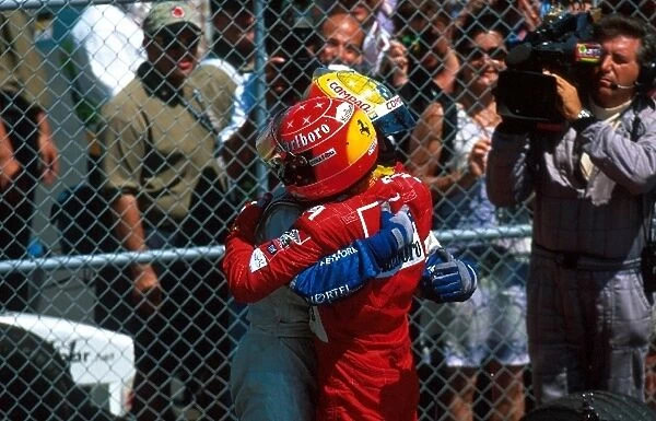 Formula One World Championship: Race winner Ralf Schumacher Williams is hugged by his brother Michael Ferrari, who ensured the first ever F1